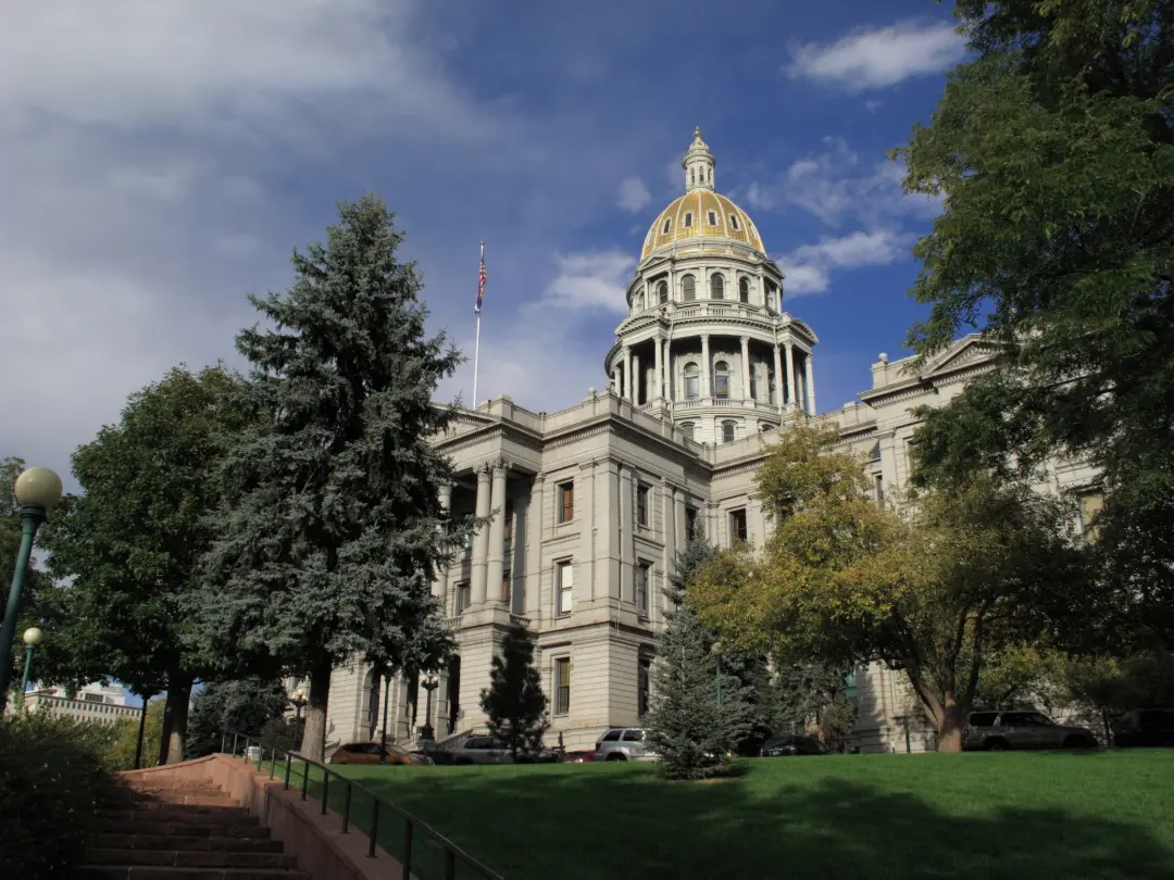 side view of the Colorado State Capitol building and its gold dome