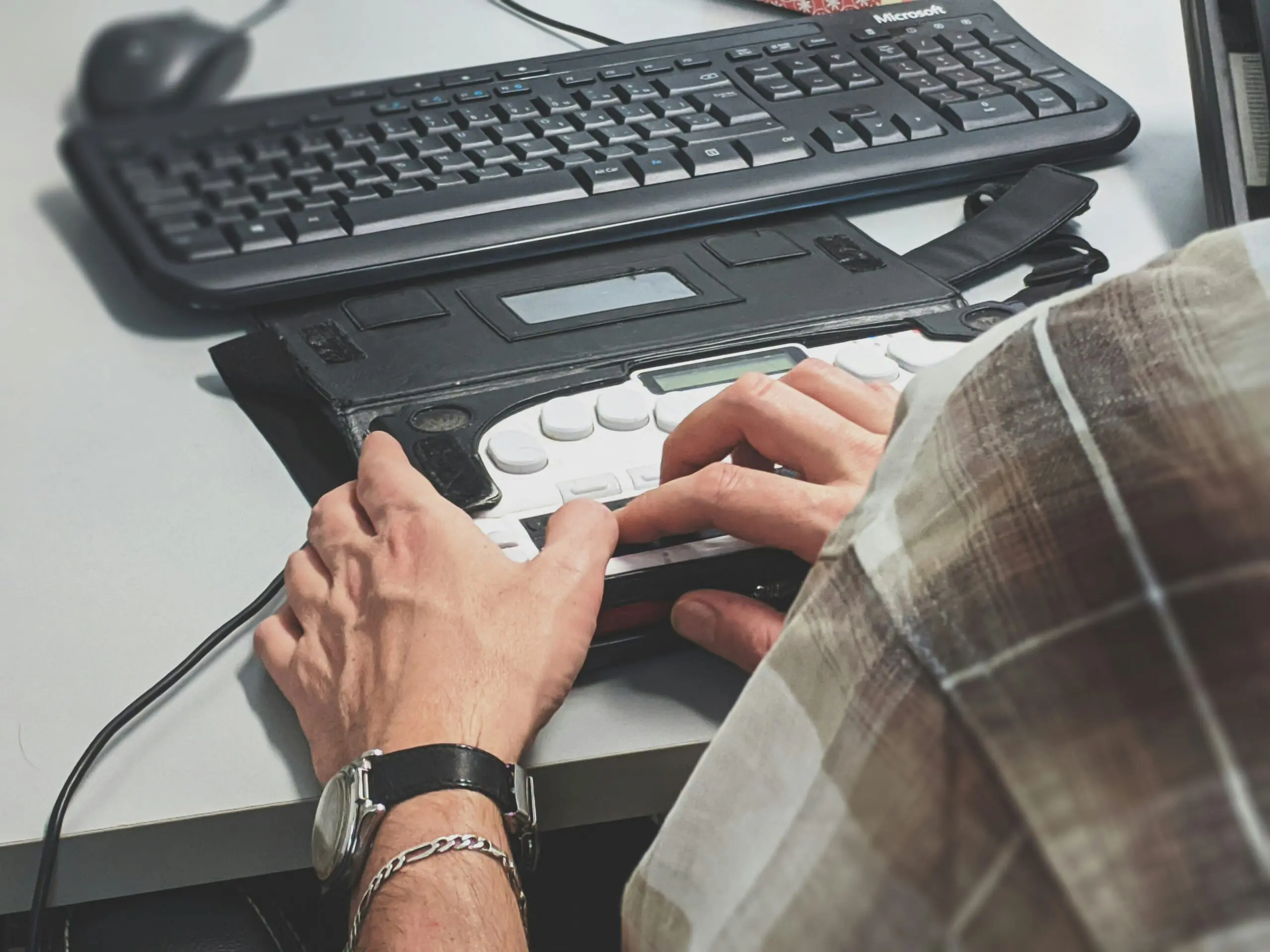 a person using an accessible device for a keyboard