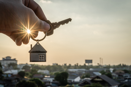 a person holding house keys