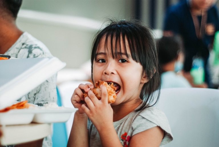 small child eating food
