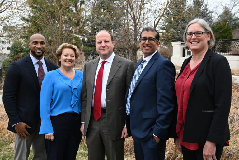 four nonprofit leaders and governor of colorado