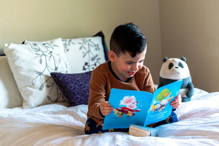 little boy reading a book