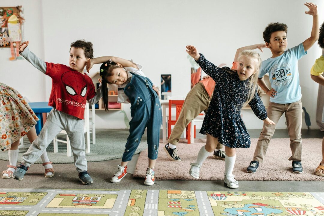 Preschoolers exercise in a classroom.